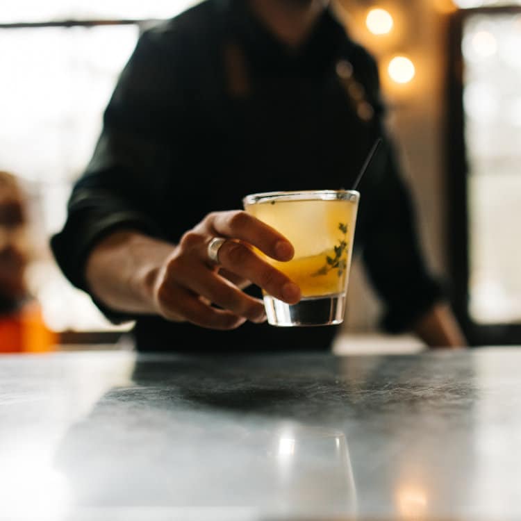 Bartender Serving a Cocktail